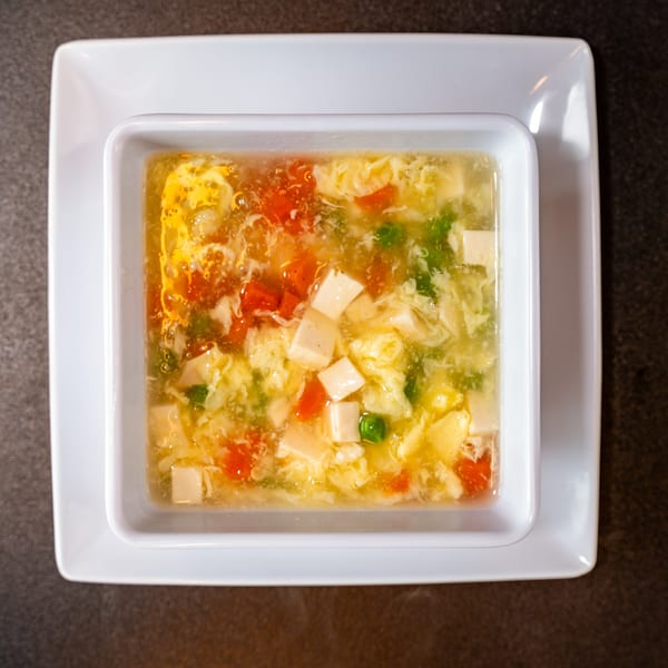 Yen Ching Express's Chinese egg drop soup with tofu, tomatoes, and green peas.