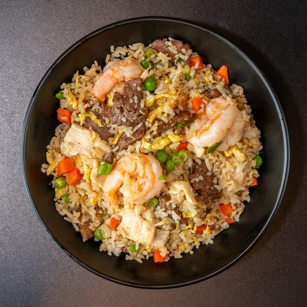 Yen Ching Express special fried rice with shrimp, beef, chicken, peas, carrots, and egg.