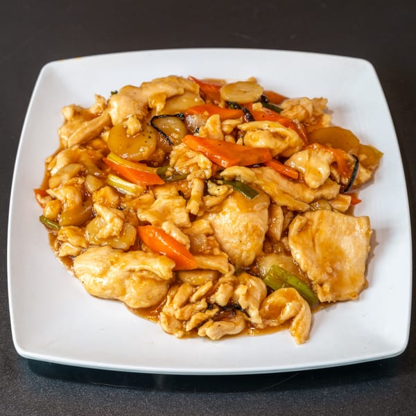 Yen Ching Express's chicken stir-fry with carrots, water chestnuts, and green onions in a savory sauce.